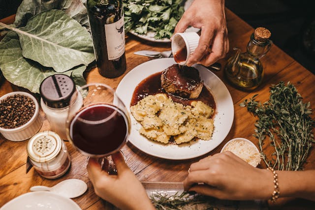 People enjoying food and wine in a restaurant