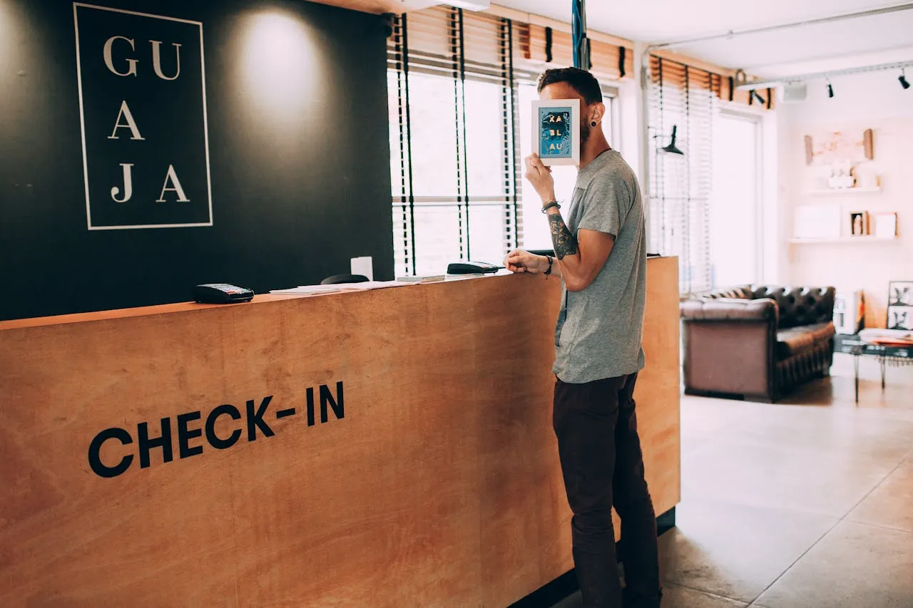 A man waiting for a check-in after he packed for a temporary motel stay.